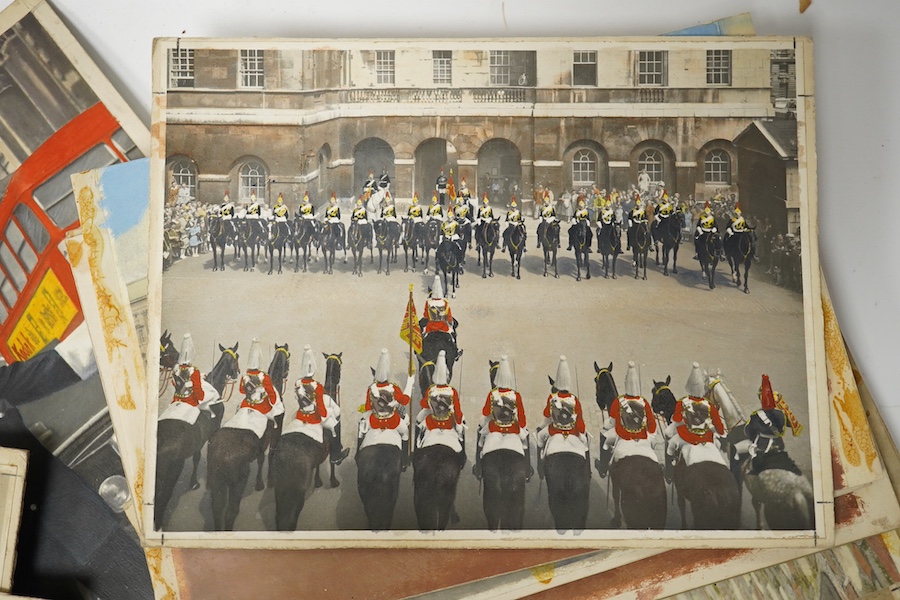 A set of thirteen original hand coloured photographs for postcards, London Pageantry scenes to include Changing the guard at Buckingham Palace, Lifeguards in the mall, London policeman and Yeoman warders at St James Pala